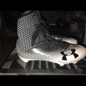 Black and white under armor cleats